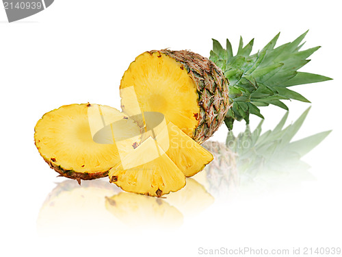 Image of ripe pineapple with slices isolated on white background