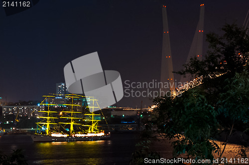 Image of night view on the sailboat Pallada near the bridge in the Russia