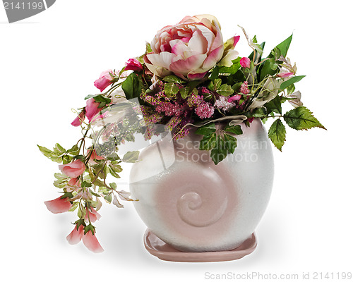 Image of colorful floral arrangement in a pink ceramic vase, isolated on 