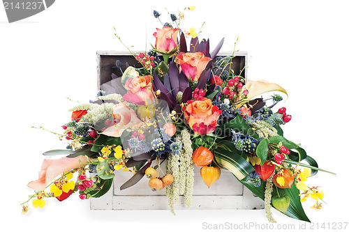 Image of colorful floral arrangement of roses, lilies, freesia and irises