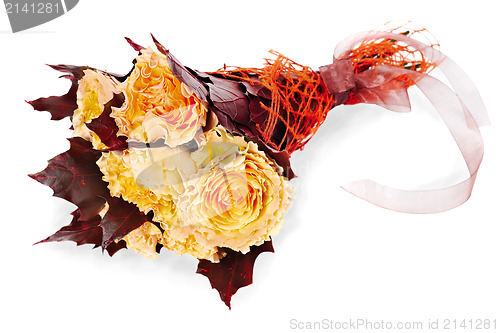 Image of colorful autumn flower bouquet  from yellow roses and maple leav