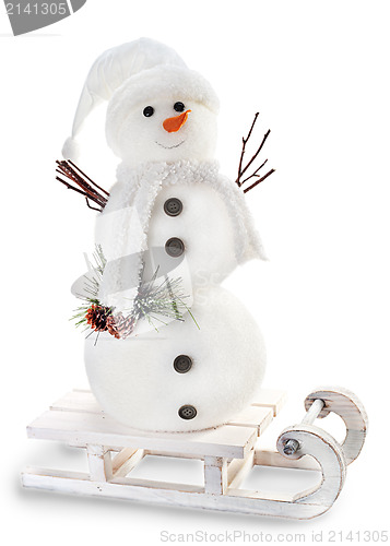 Image of snowman on sled isolated on white background 