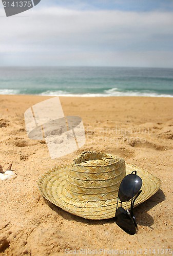 Image of Seacoast and straw hat 