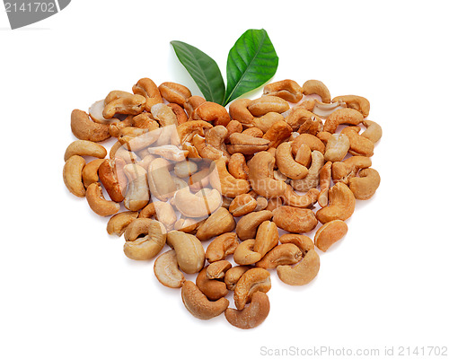 Image of Cashew nuts in the form of heart with leaves isolated on white b