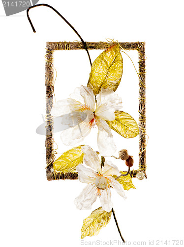 Image of decorative frame with artificial flowers