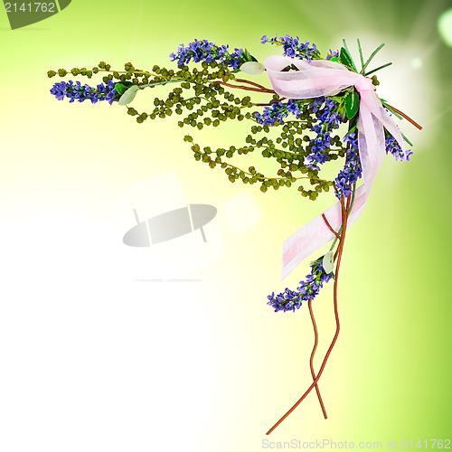 Image of abstract nature background with sprigs of blue and green with a 