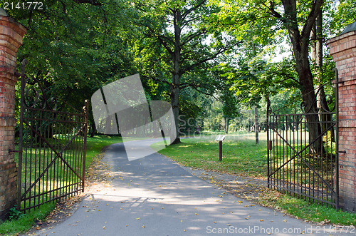 Image of large antique gate in the park 