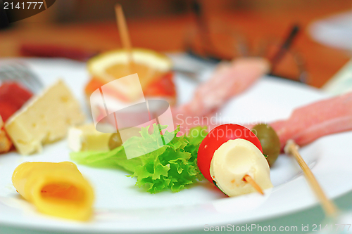 Image of appetizer, focus on green salad