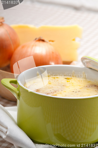 Image of oinion soup with melted cheese and bread on top