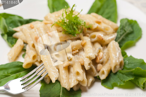 Image of Italian pasta penne gorgonzola and pine nuts