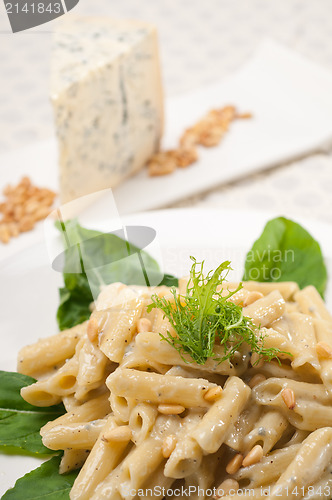 Image of Italian pasta penne gorgonzola and pine nuts