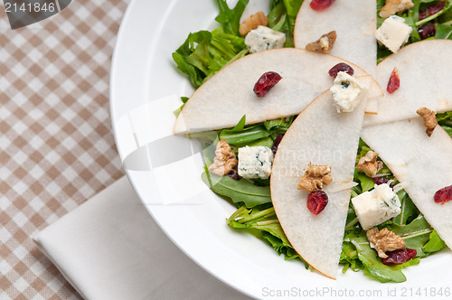 Image of Fresh pears arugula gorgonzola cheese salad