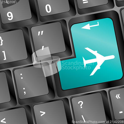 Image of Online tickets key on the keyboard with airplane