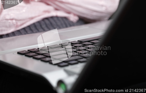 Image of Young woman working on laptop