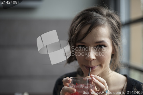 Image of Young Woman Drinking a Shirley Temple