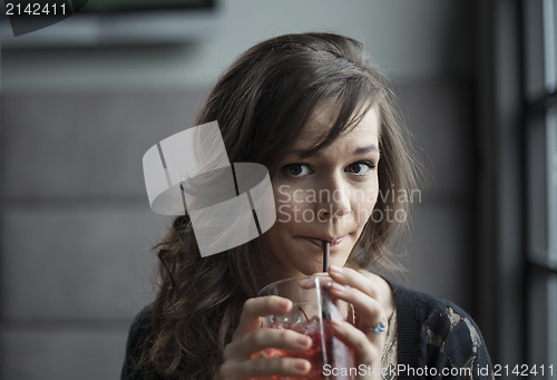 Image of Young Woman Drinking a Shirley Temple