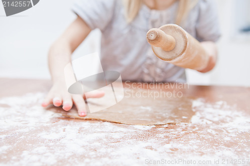 Image of Young girl making gingerbread