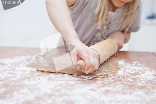 Image of Young girl making gingerbread