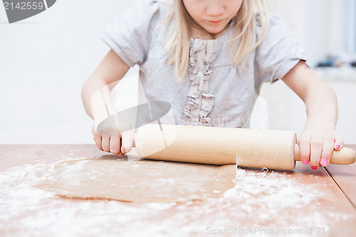 Image of Young girl making gingerbread