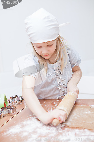 Image of Young girl making gingerbread