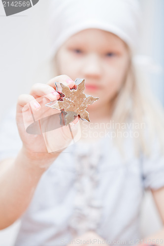 Image of Star shaped piece of gingerbread dough