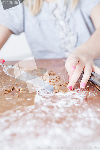 Image of Shaped gingerbread dough moved with server