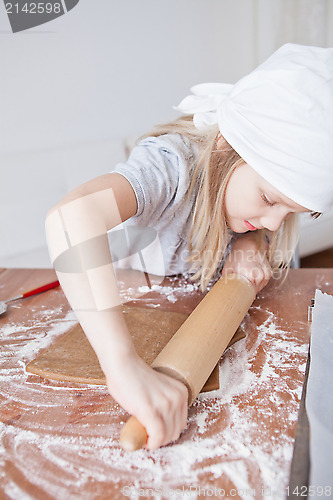 Image of Young girl making gingerbread