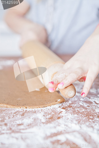 Image of Young girl making gingerbread