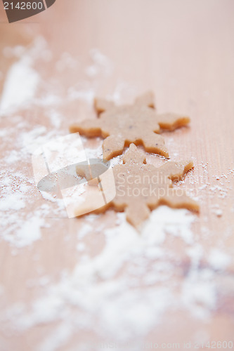 Image of Two shaped gingerbread dough pieces