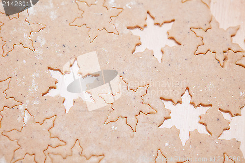 Image of Gingerbread dough with star shapes