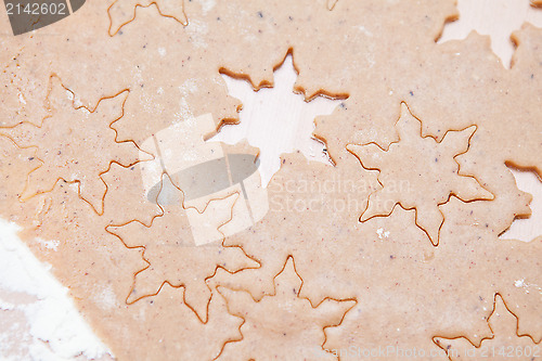 Image of Gingerbread dough with star shapes