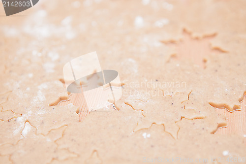 Image of Gingerbread dough with star shapes