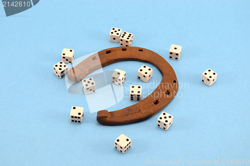 Image of retro horseshoe gamble dice concept blue 