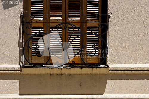 Image of old window grate and shadow 