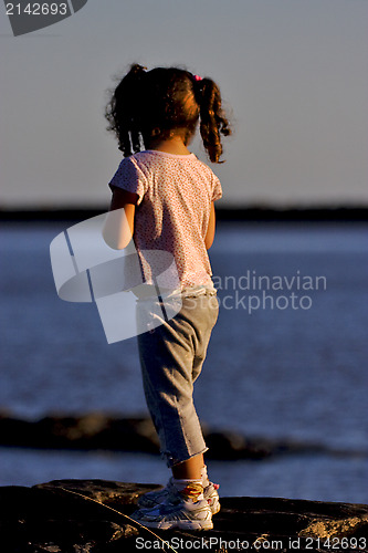 Image of little girl  near the  beach rio de la plata 