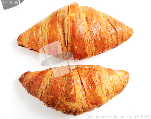 Image of two fresh croissant on a white
