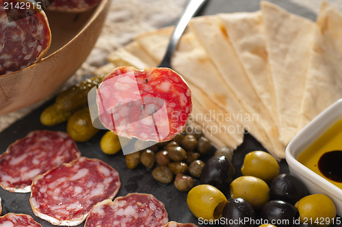 Image of cold cut platter with pita bread and pickles