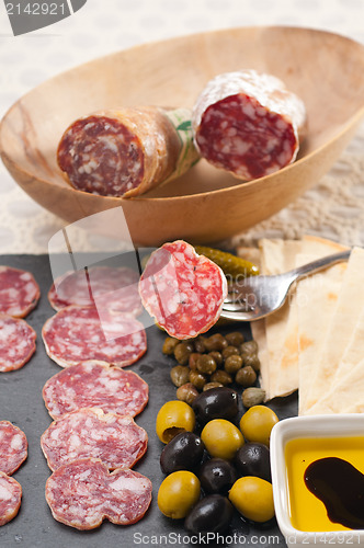 Image of cold cut platter with pita bread and pickles