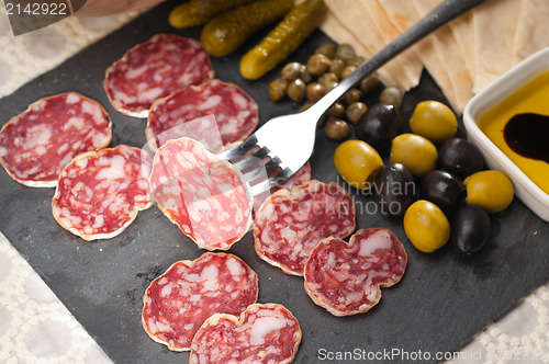 Image of cold cut platter with pita bread and pickles