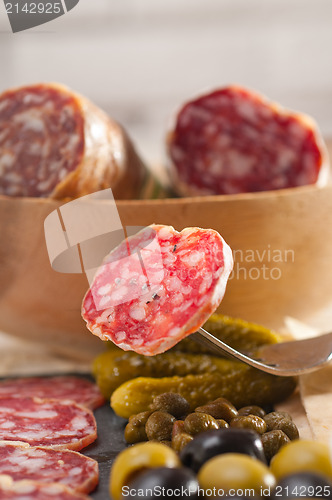 Image of cold cut platter with pita bread and pickles