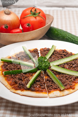 Image of Turkish beef pizza with cucumber on top