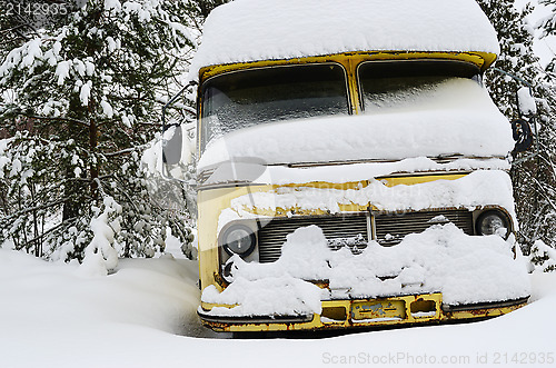 Image of old vinage bus covered with winter snow 