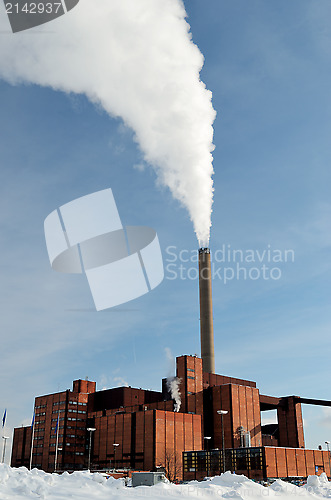 Image of power station in winter, steam from stack