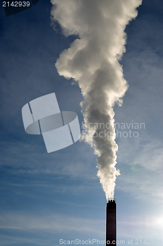 Image of steam from stack against blue sky