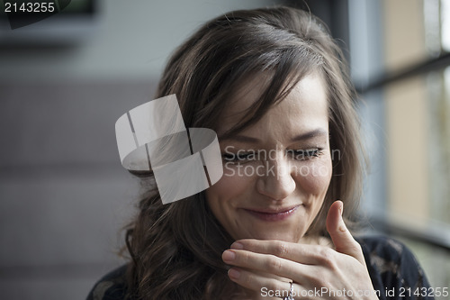 Image of Portrait of Beautiful Young Woman with Brown Hair Laughing