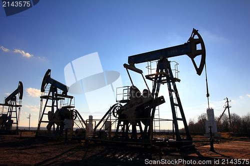 Image of working oil pumps silhouette