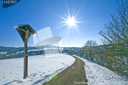 Image of Jesus on cross in wintertime