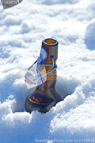 Image of Beer bottle in snow