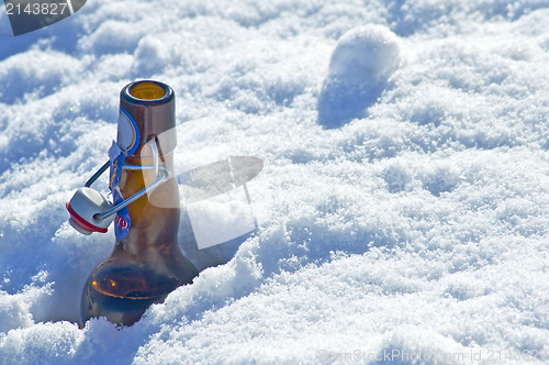 Image of Beer bottle in snow
