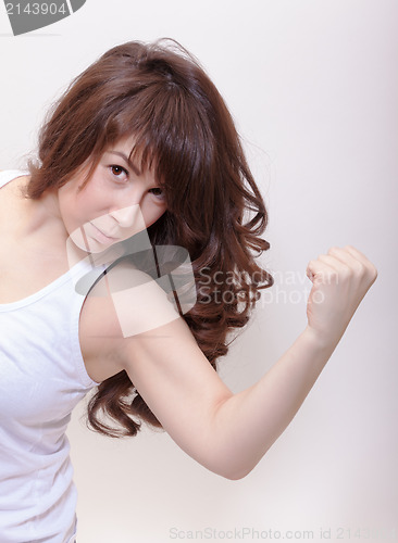 Image of Attractive woman making a fist